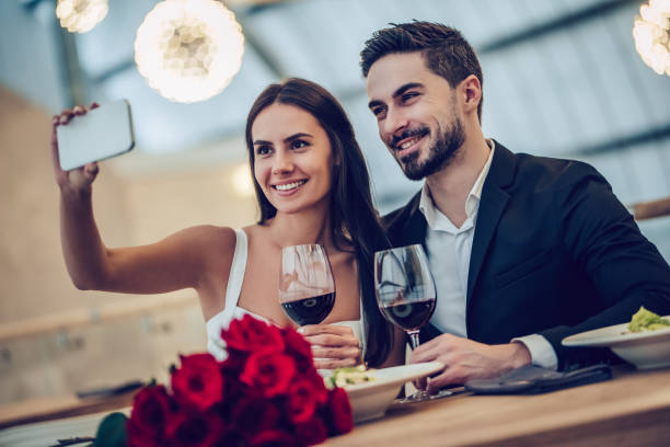 istock Romantic couple in restaurant 908336750