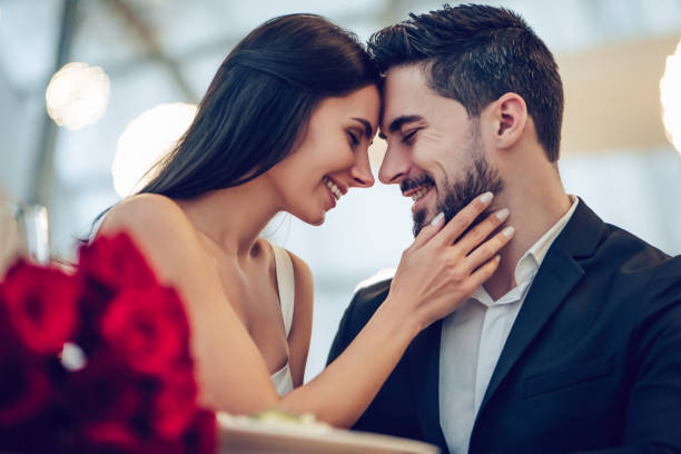 istock Romantic couple in restaurant 908336754