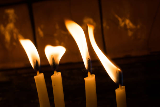 istock Burning candles give light in the dark 908339934