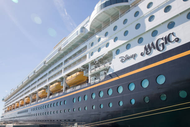 Cruise liner Disney Magic at Key West, Florida - January 18, 2018: Cruise liner docked in port of Key West, is waiting for the passengers who's having promenade to board.