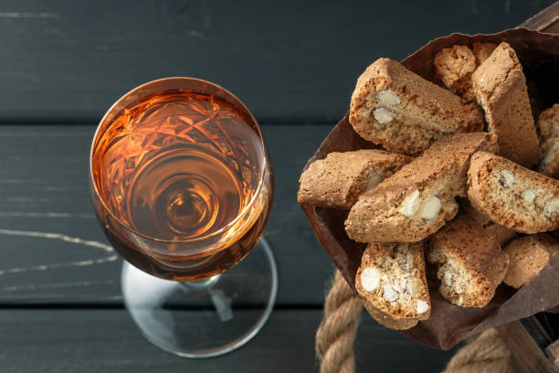 istock Italian cantucci biscuits and a glass of wine 908345428