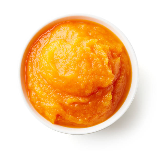 istock Pumpkin and carrot baby puree isolated on white 908346176