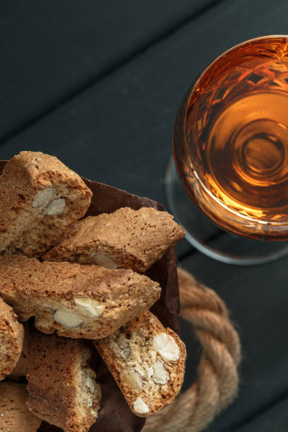 istock Italian cantucci biscuits and a glass of wine 908347298