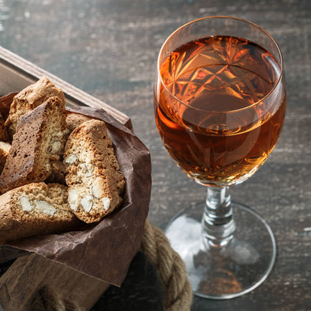 istock Italian cantucci biscuits and a glass of wine 908347416