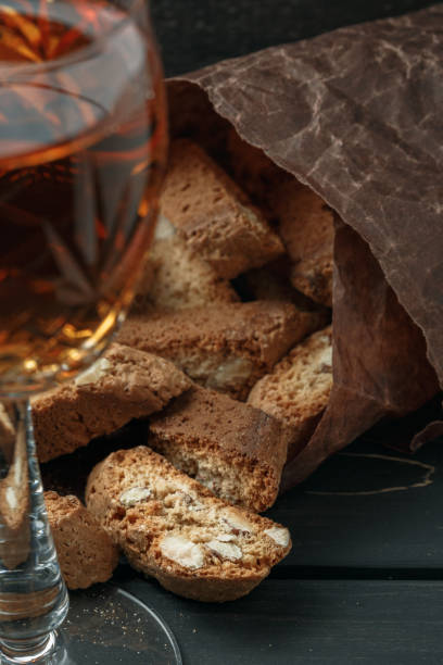 istock Italian cantucci biscuits and a glass of wine 908347564