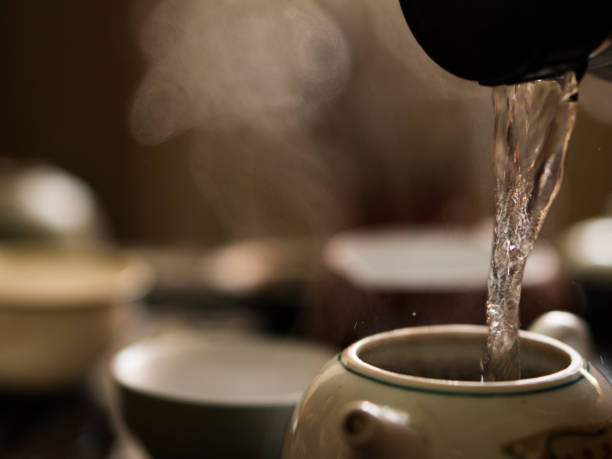 istock Green Tea Pouring in Traditional Chinese Tea Ceremony 908347648