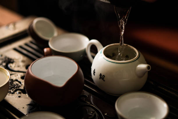 istock Green Tea Pouring in Traditional Chinese Tea Ceremony 908349916