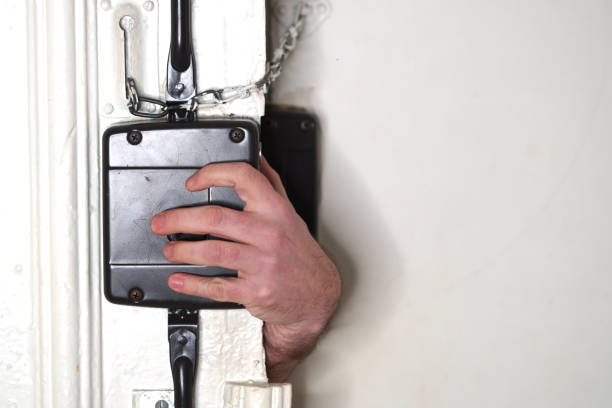 istock Burglar opening door 908353108