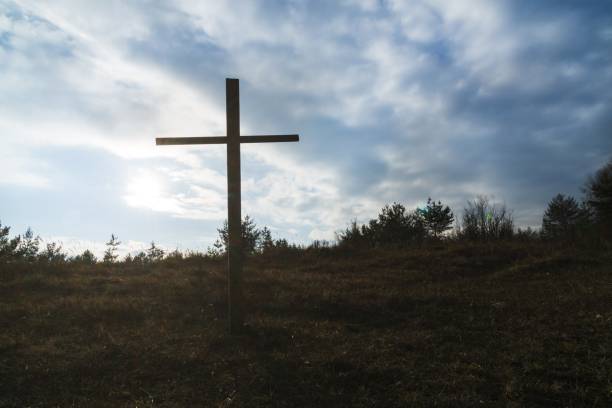 istock Wooden cross in the forest. 908353550