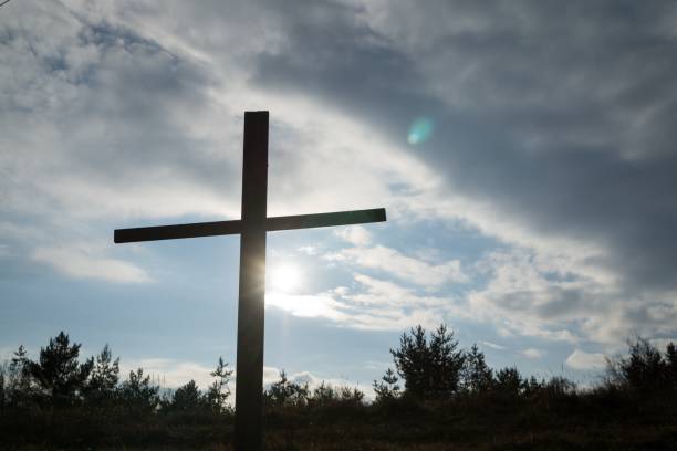 istock Wooden cross in the forest. 908353570