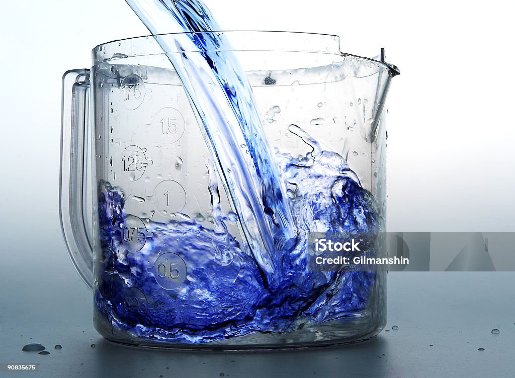 Blue liquid Blue liquid flowing in to a jar Abstract Stock Photo