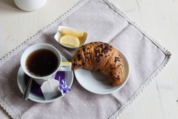 istock Cup of Tea and Croissant for Breakfast 908357078