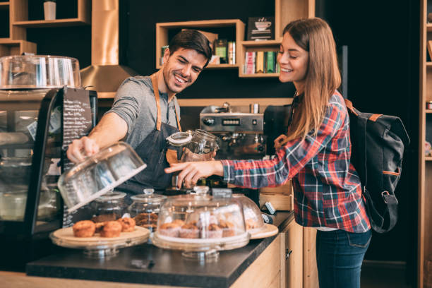 istock Woman buying muffins 908362982