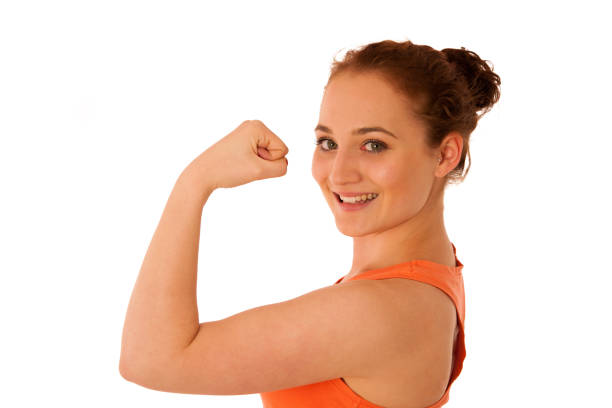 istock Woman showing her arm as a gesture for strrength 908367342