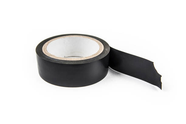 istock Black vinyl insulating electric tape on the white background 908376850