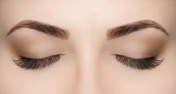 Photo of Beautiful Woman with long lashes in a beauty salon.