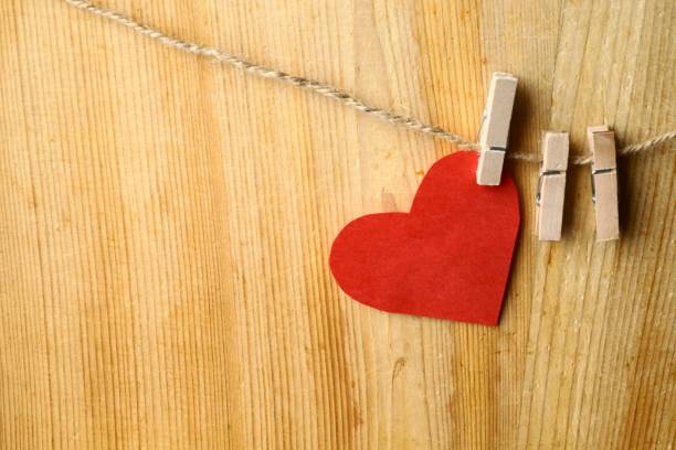 istock Red heart  on a wooden background 908379636