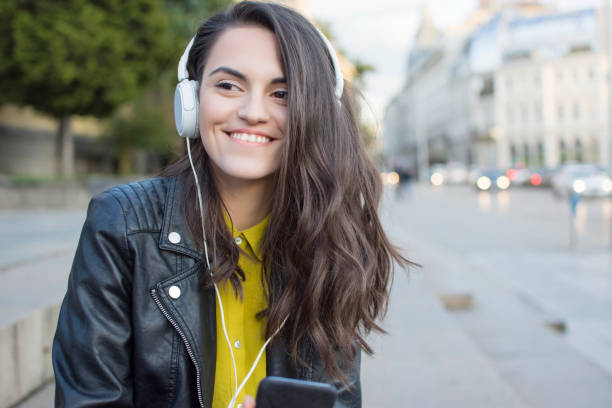 istock Woman listening music 908382990