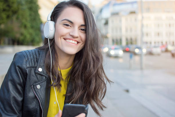 istock Woman listening music 908383042