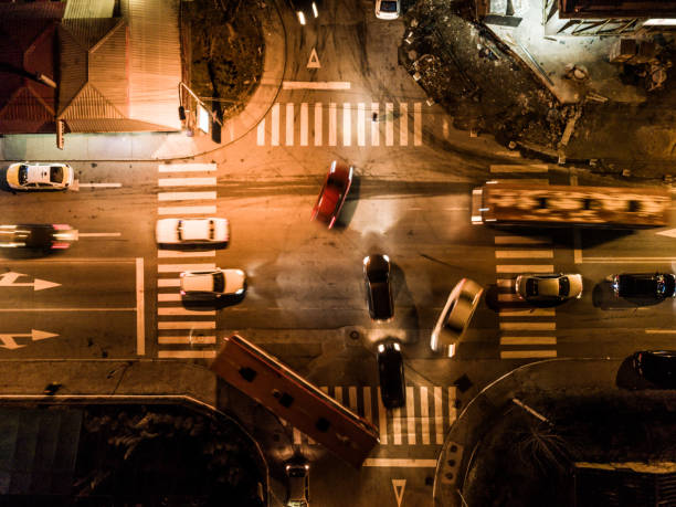 istock aerial view of a intersection at night at rush hour. long exposure 908385838