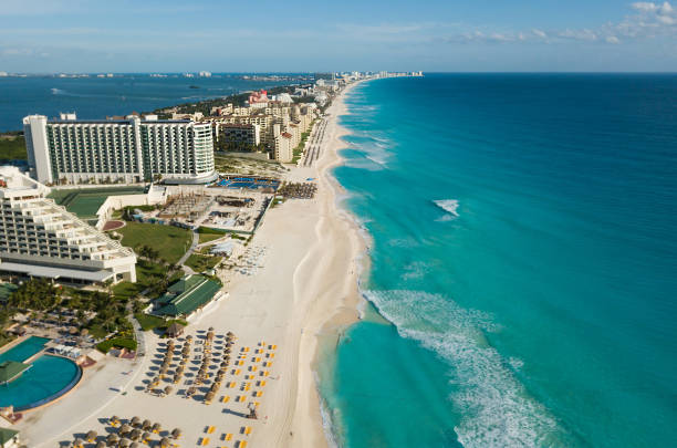 Cancun beach panorama aerial view. Aerial view of Caribbean Sea beach. Zona hotelera top view. Beauty nature landscape with tropical beach. Caribbean seaside beach with turquoise water and big wave Aerial view of Caribbean Sea beach. Top view aerial video of beauty nature landscape with a tropical beach. Cancun, Mexico, cancun photos stock pictures, royalty-free photos & images