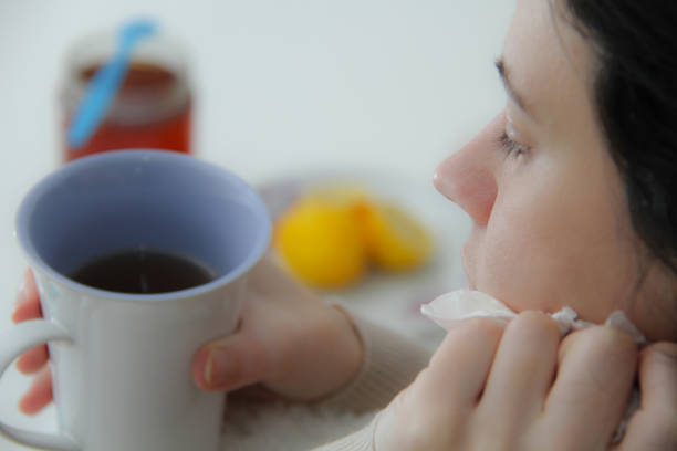 istock Young sick woman laying in bed 908398316