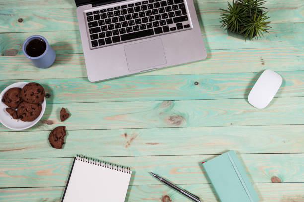 istock Blue office desk table with with office supplies. 908401216