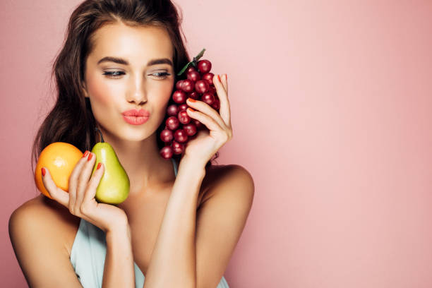 Woman holding fruits