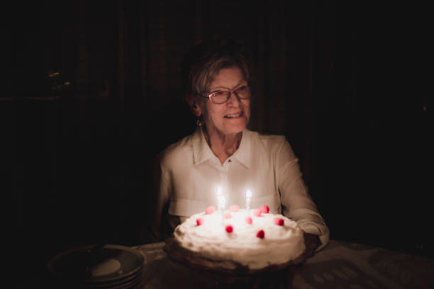 istock Birthday Celebration of an elderly woman 908401338