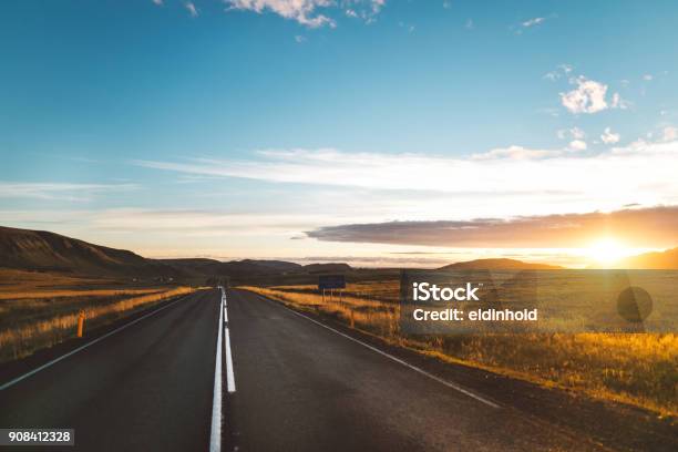 Driving Icelands Ring Road Selfdrive Tournumber 1 Road On Iceland Scenic Panoramas Near The Highwaytourist Attraction And Campers Tour Routebeautiful Golden Sunset Illuminates Asphalt Road Stock Photo - Download Image Now