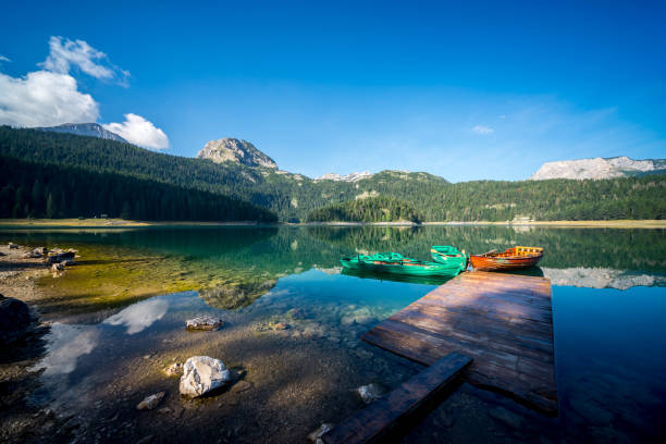 istock Boats on a mountain lake 908419080