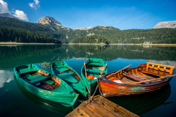 istock Boats on a mountain lake 908419578