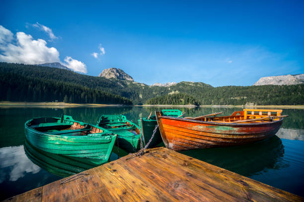 istock Boats on a mountain lake 908423396