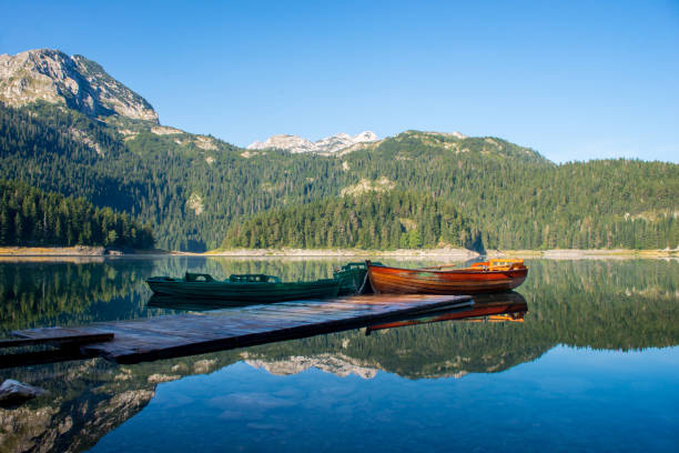istock Boats on a mountain lake 908424206