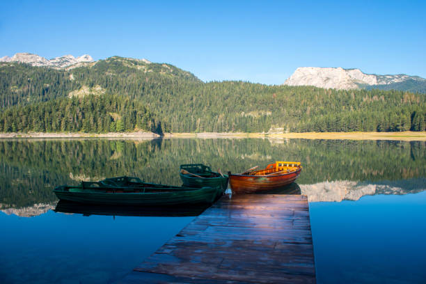 istock Boats on a mountain lake 908428018
