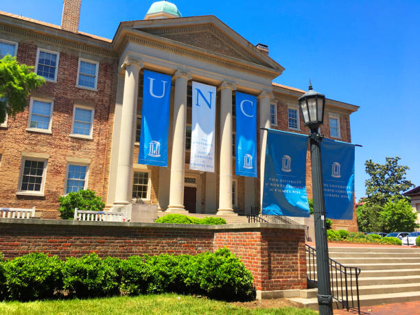 The South Building at The University of North Carolina at Chapel Hill The South Building at The University of North Carolina at Chapel Hill in Chapel Hill, North Carolina is adorned with banners on a beautiful spring day. university of north carolina stock pictures, royalty-free photos & images
