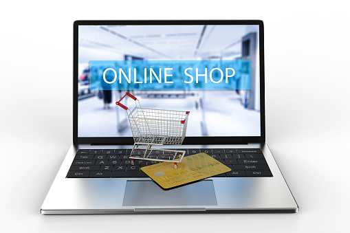 online shopping concept with 3d rendering computer notebook with shopping cart and credit card