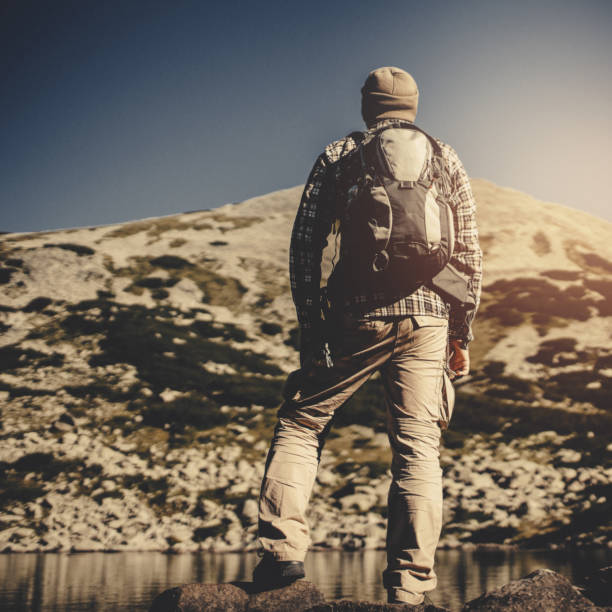 istock Hiking in the mountains alone 908437370