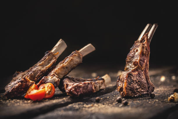 istock Grilled lamb chops on wooden table 908440016