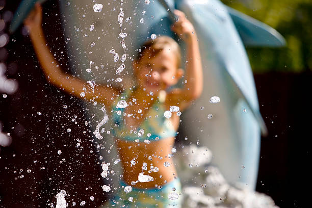 Young Girl in Fountain stock photo