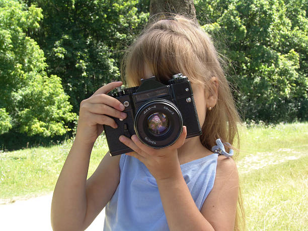 istock little girl with big camera 90844412