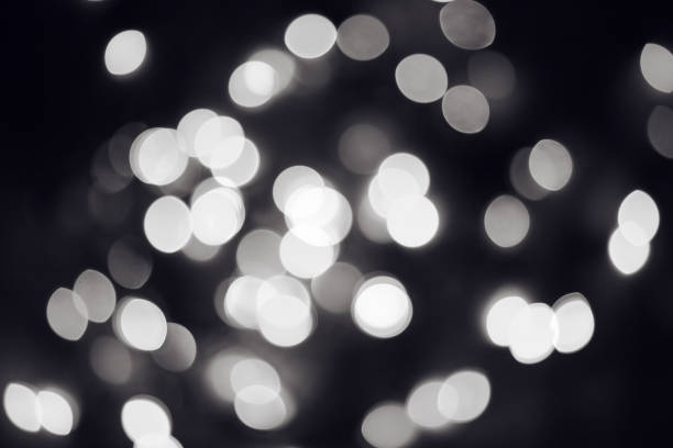 istock Black and white Christmas Lights Bokeh 908446844