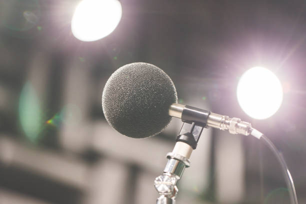 istock High accuracy microphone in noise (sound) testing room with LED light bokeh. High technology. Microphone for nosie recorder. Selective focus. 908456272