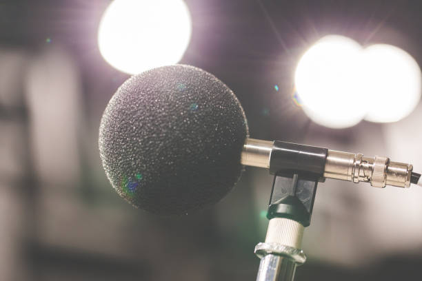 istock High accuracy microphone in noise (sound) testing room with LED light bokeh. High technology. Microphone for nosie recorder. Selective focus. 908456282