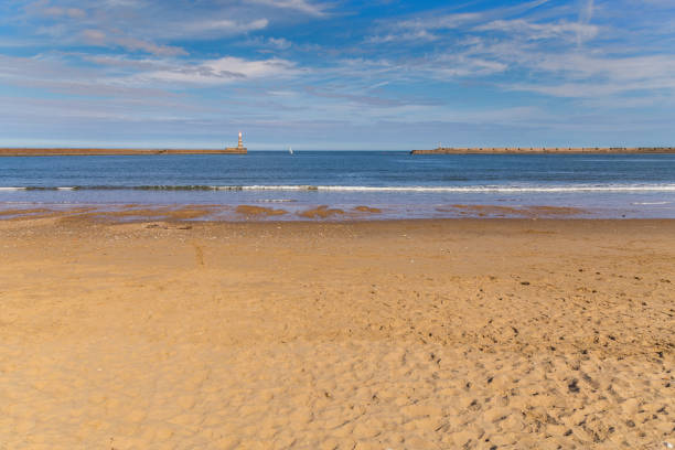 Lighthouse and pier at the North Sea coast of Roker Beach in Sunderland, Tyne and Wear, UK