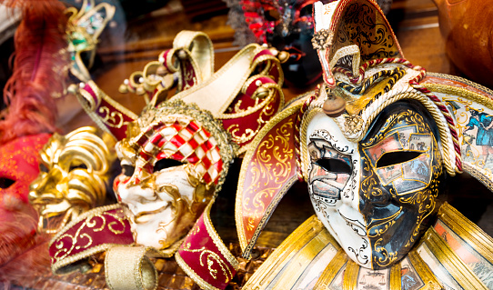 Store window decorated with Venetian style Carnival mask.  Spanish culture, tradition. Galicia, Spain.