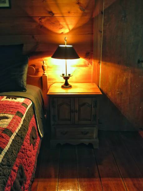istock Adirondack Style Bedspread, Lamp on Table, Log Cabin Home Interior 908469144