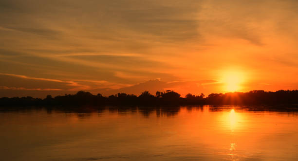 Photo of Beautiful sunset on the river bank.