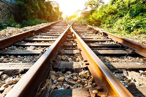 Crossroad railroad track at sunset