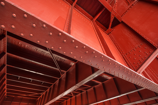 A wide angle view of the underside of bridge structure.